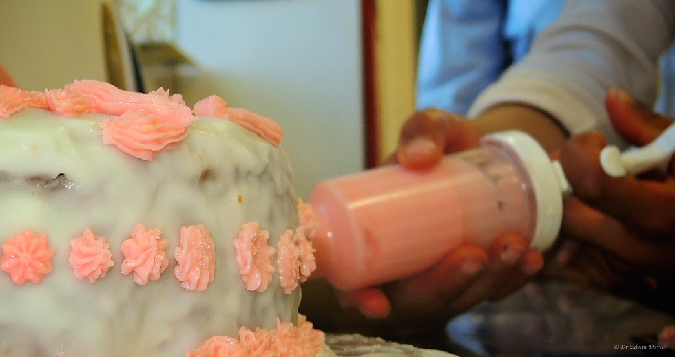 Icing a birthday cake