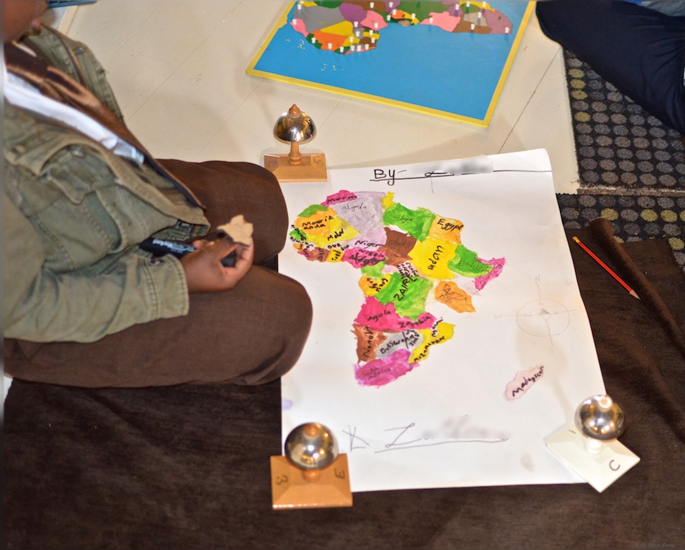7 year old student with his own map of Africa