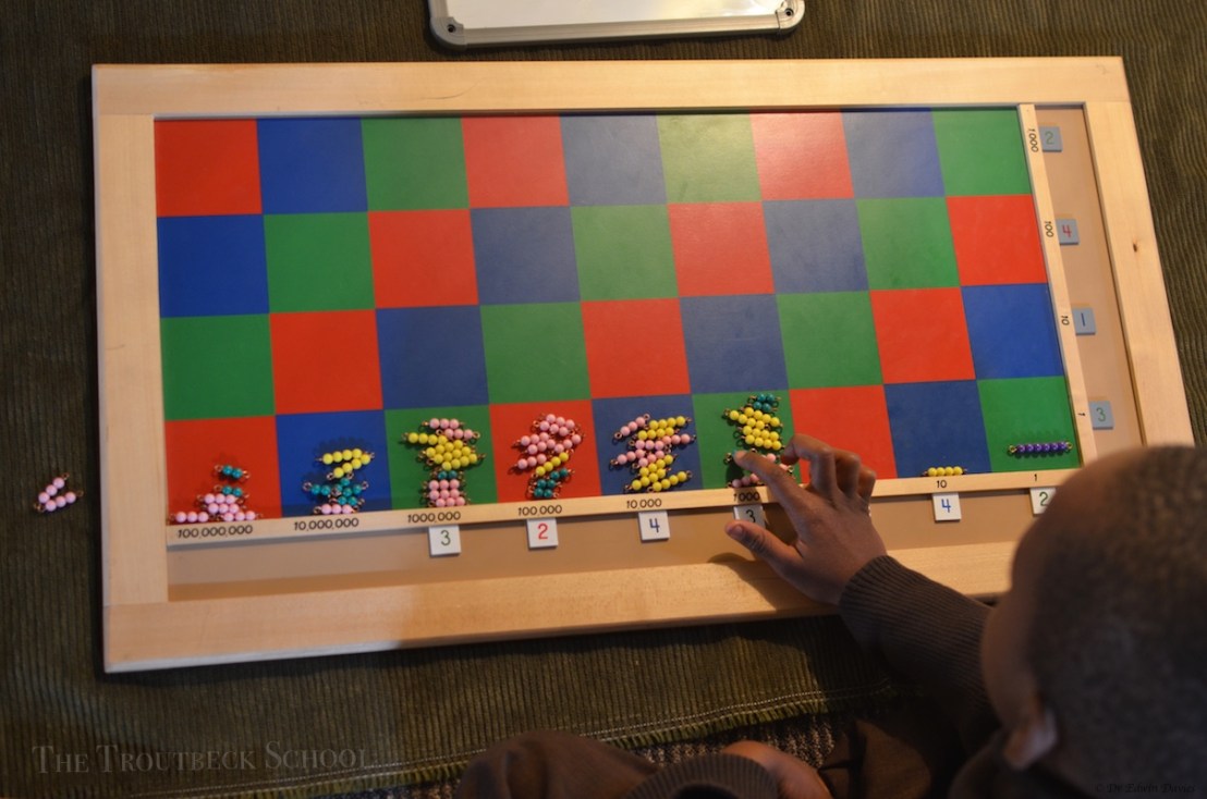 4 digit multiplication using the Montessori checker board