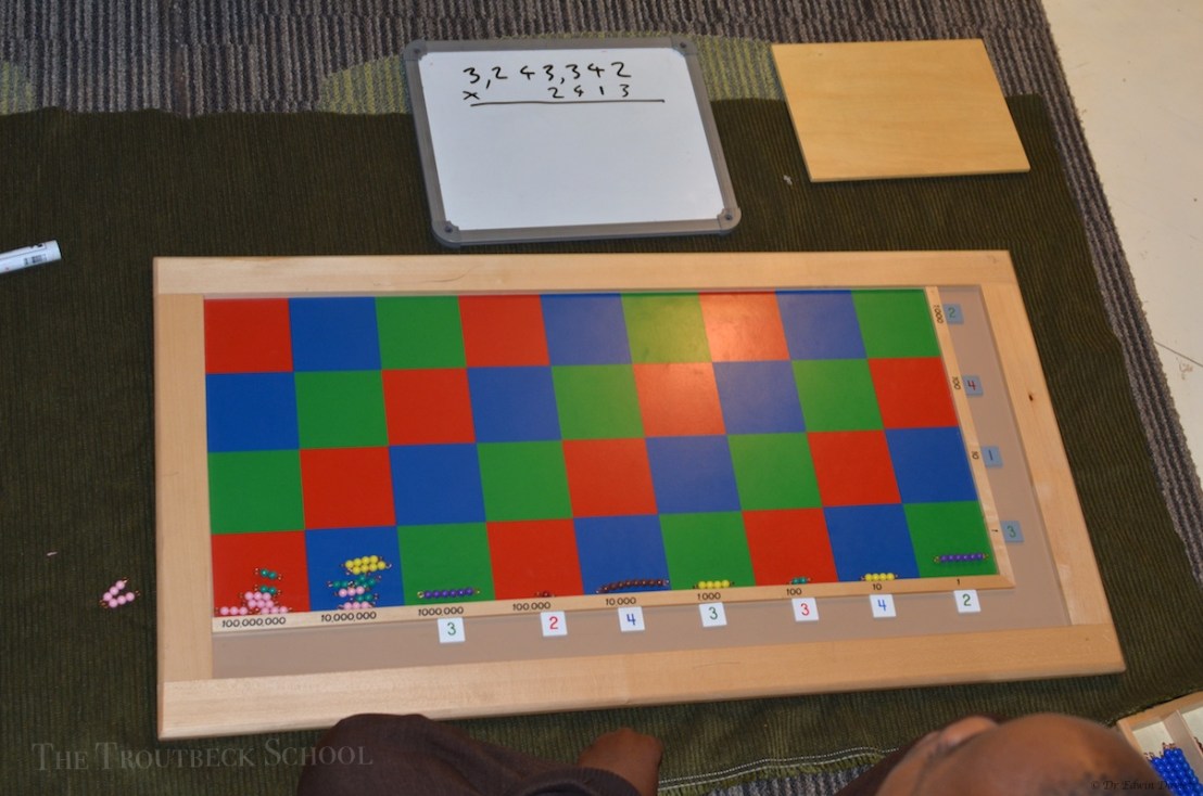 4 digit multiplication using the Montessori checker board